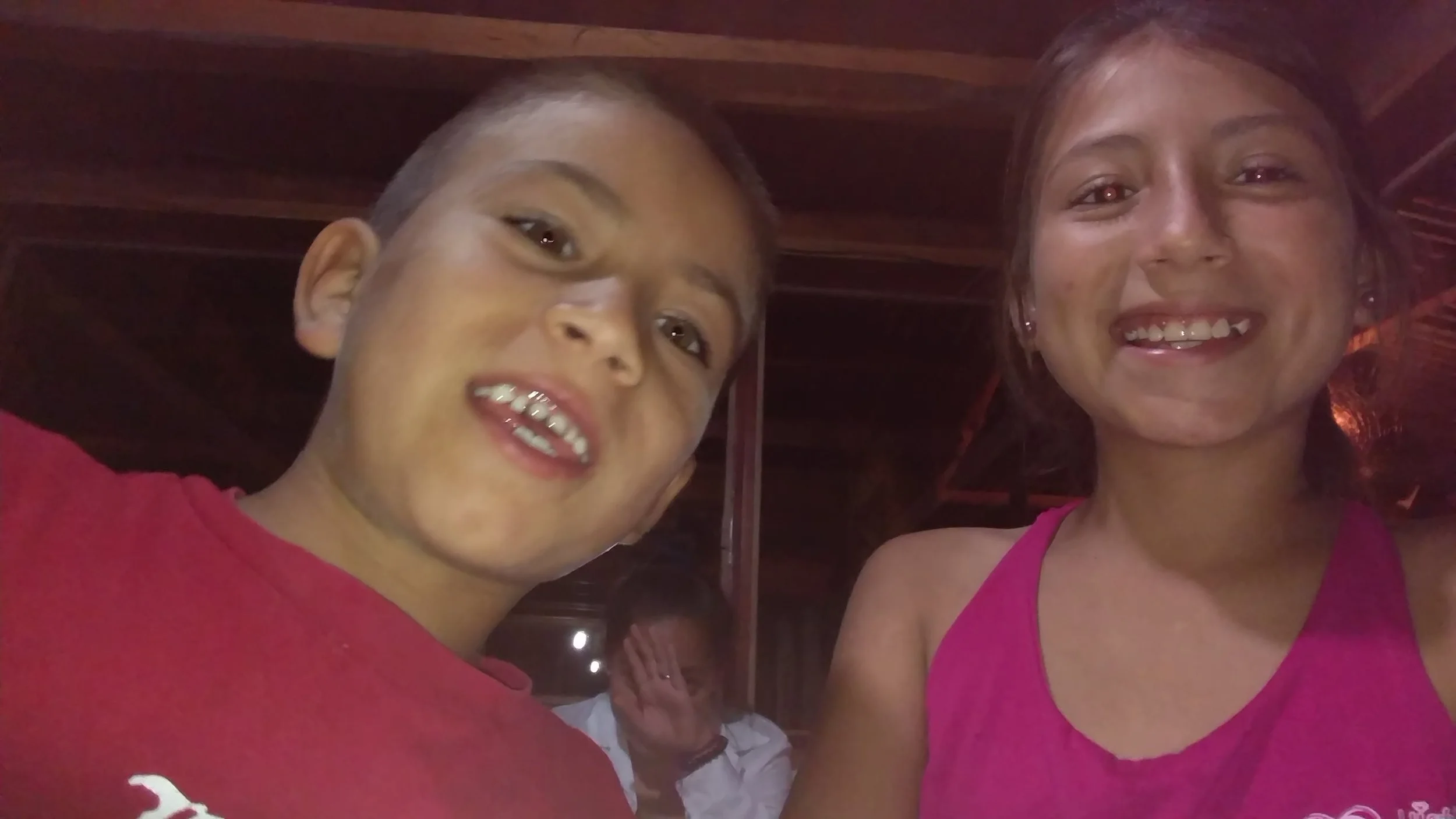 Brandon and Samantha are 8 and 11 years old. Nayely wants no part of the photo!
