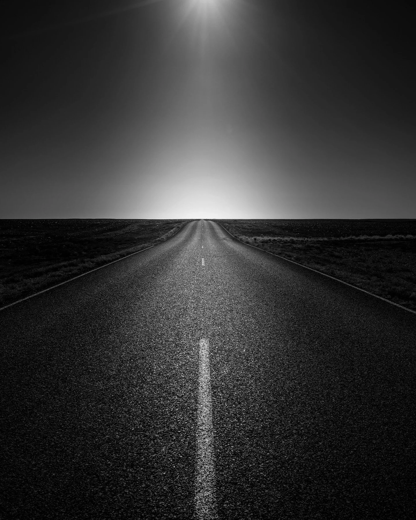 Straight into the sun&hellip;
Coober Pedy, Central Australia. 

#blackandwhite #photography #fineart #roadtrip #whiteline #straightroad #cooberpedy #southaustralia #outback #centralaustralia