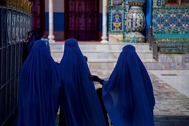 Prayers and Shadows. Mazar-I-Sharif, Afghanistan. Families gather at the Blue Mosque in this ancient Balkh town in the northern region of Afghanistan. Here they socialize, pray, and gather to discuss politics, economics, and everyday life. Everybody 