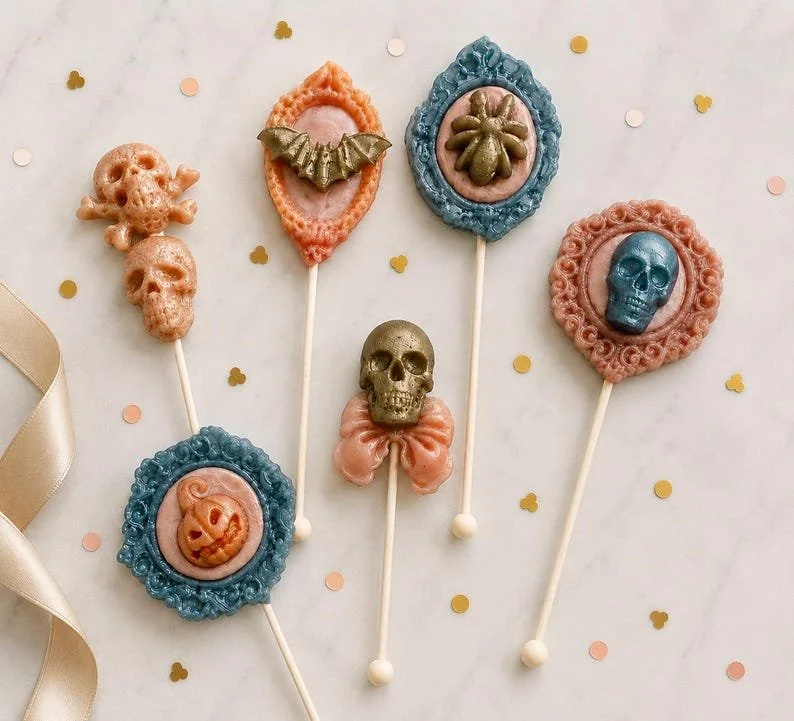 Sweet Suite edible Halloween lollipops in jewel-toned frames and skull designs
