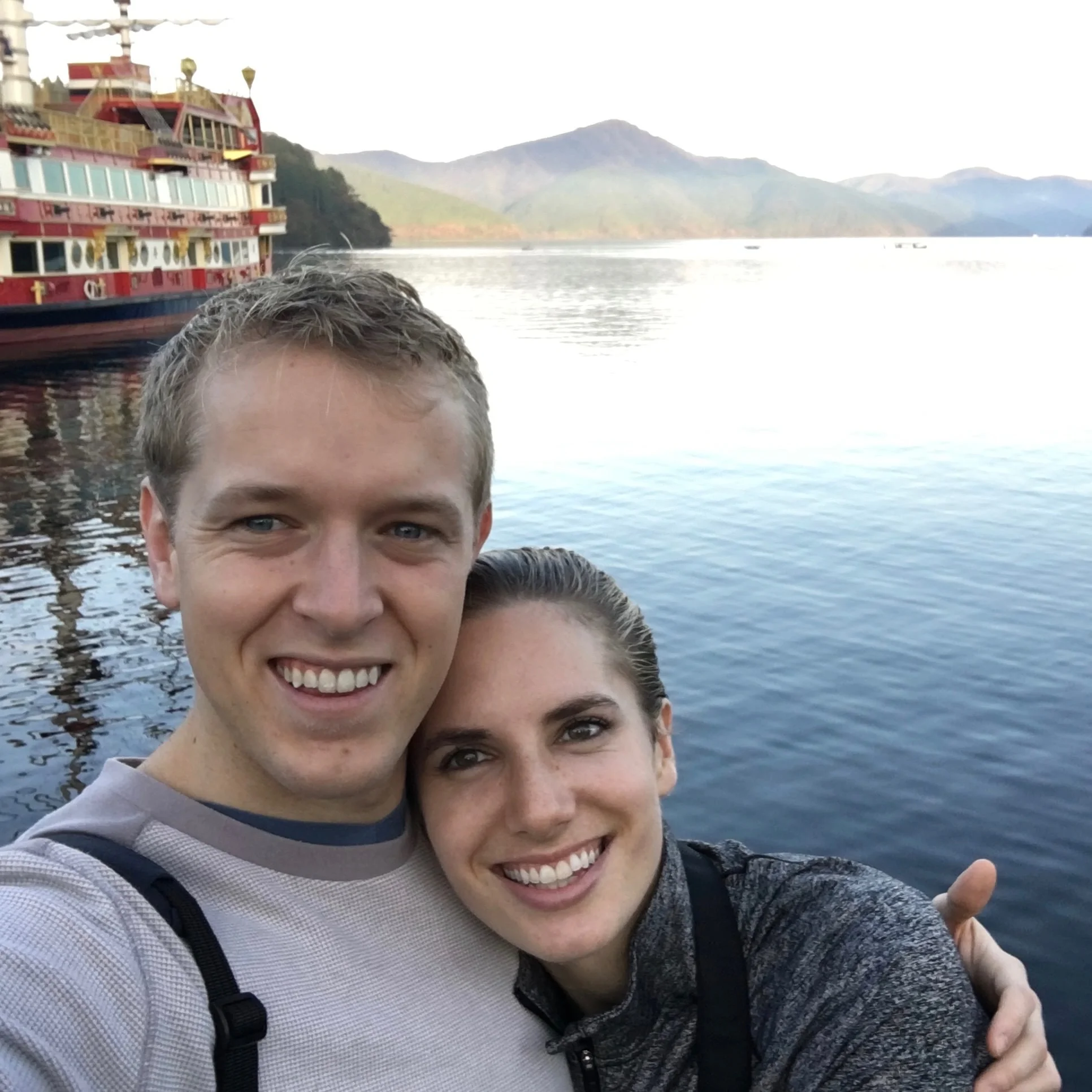 Sunrise on Lake Ashi. Annie forced Adam to wake up to see it.