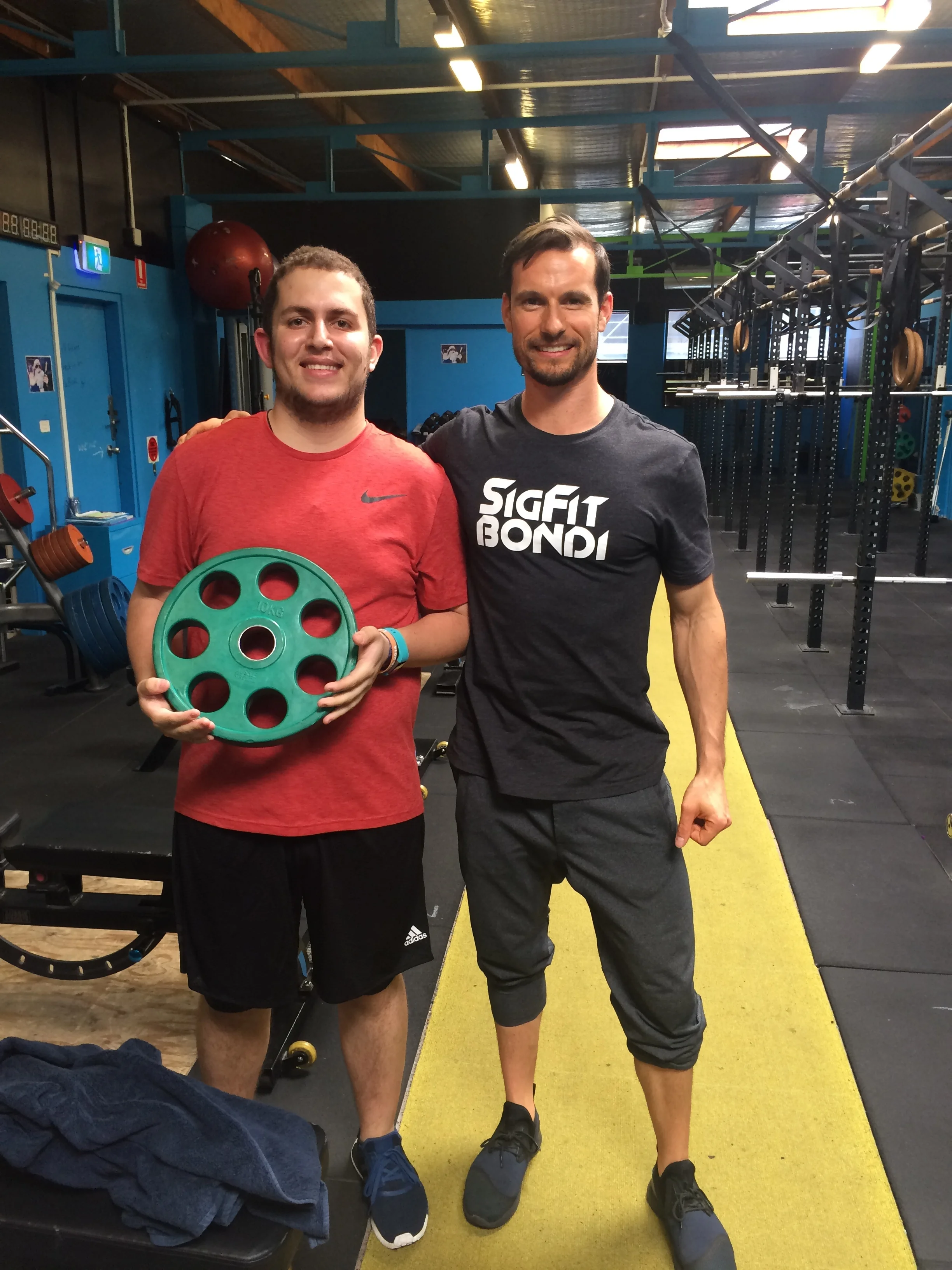 Adib displaying the 10kgs of weight he has dropped so far.