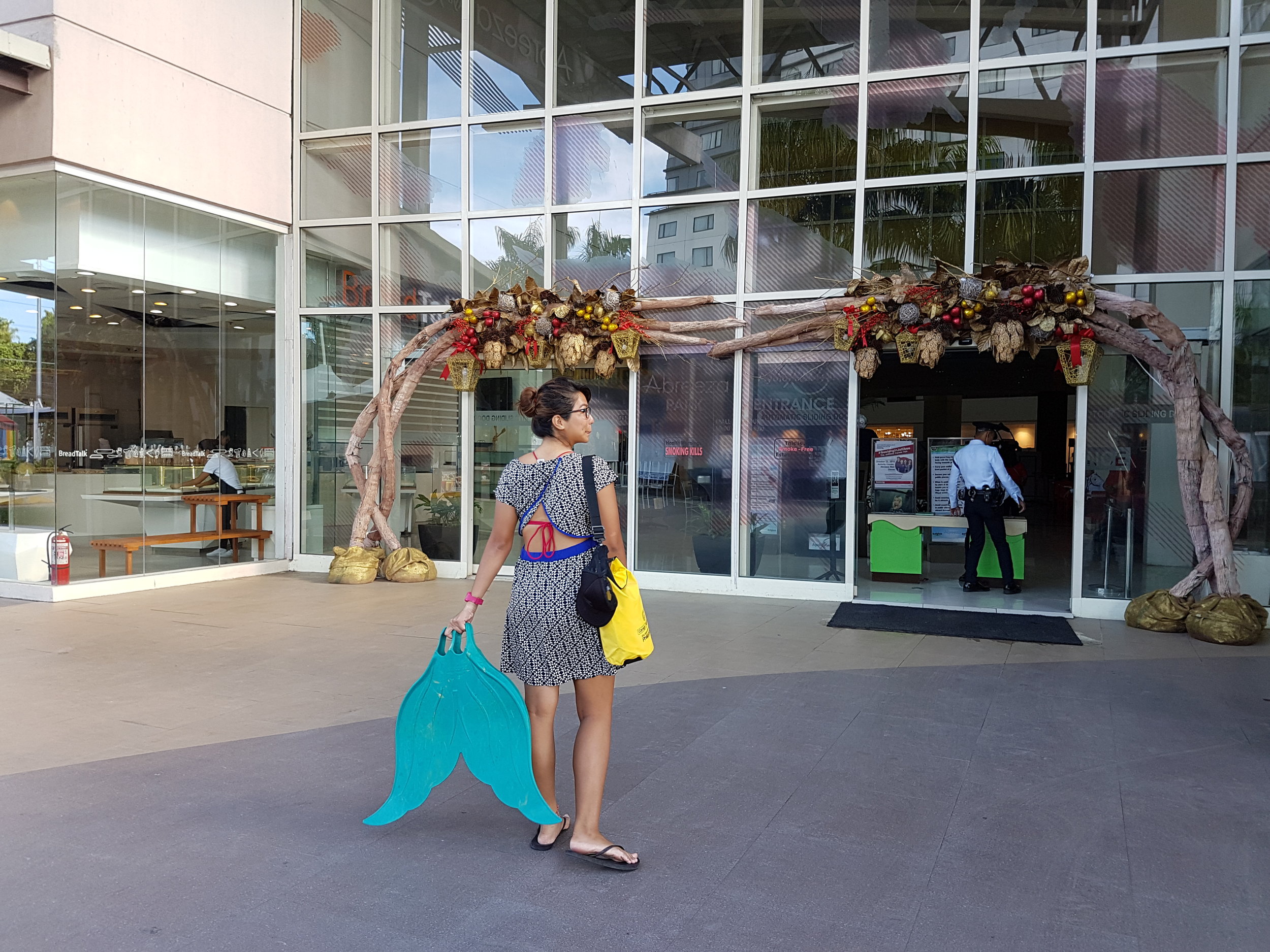Shamelessly walking into malls with your fins - yep, signs of a mermaid. *Overswim / dress: Roxy | Bikini top: Calavera | Dry bag from DOT R13 (yey!)*