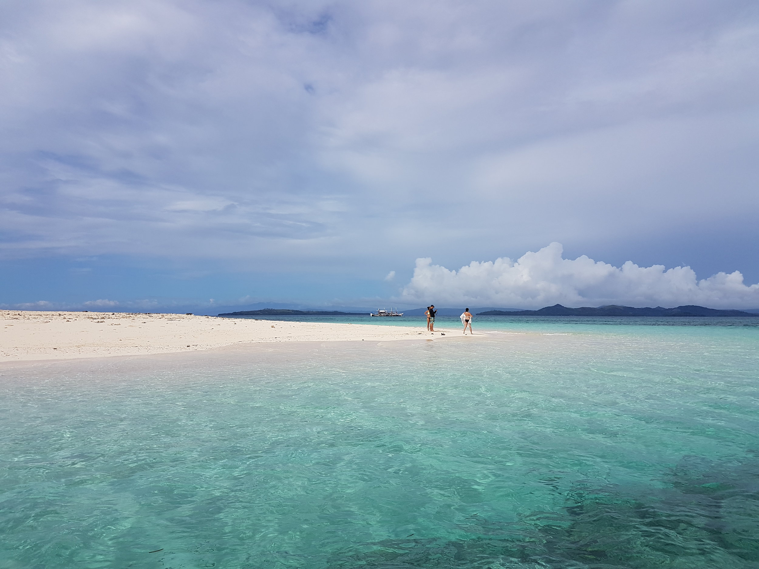 The sandy side of Naked Island is perfect for bumming and getting that glorious tan.