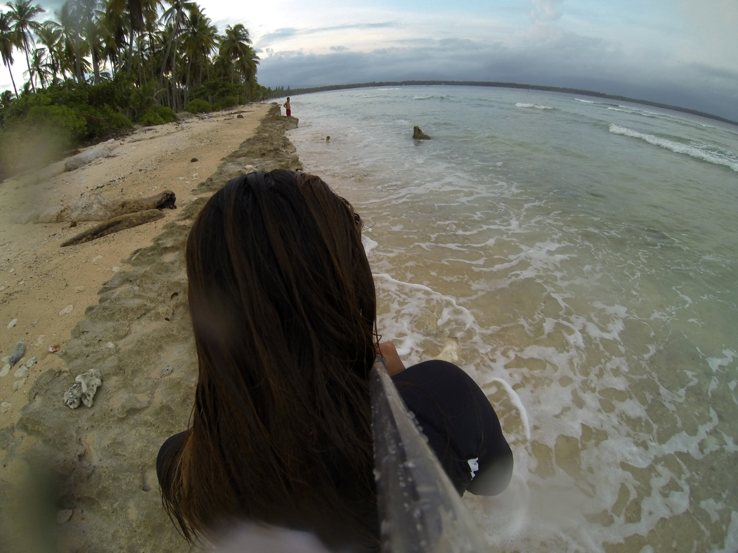 Walking along the shore after a good day of waves and wipe outs.