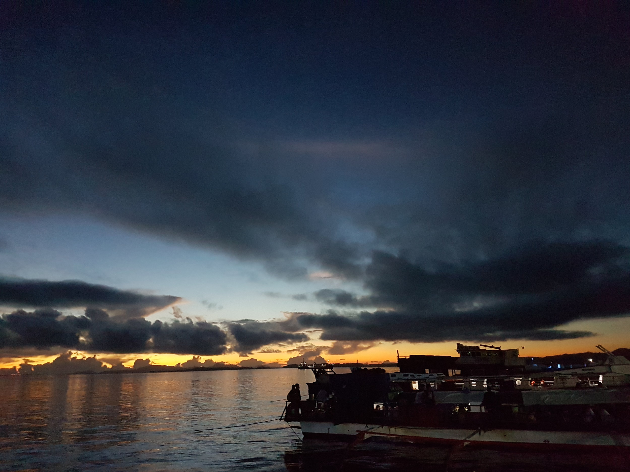 The 5:00am view of Surigao City’s Boulevard taken from the big outrigger boat sailing for Siargao Island.