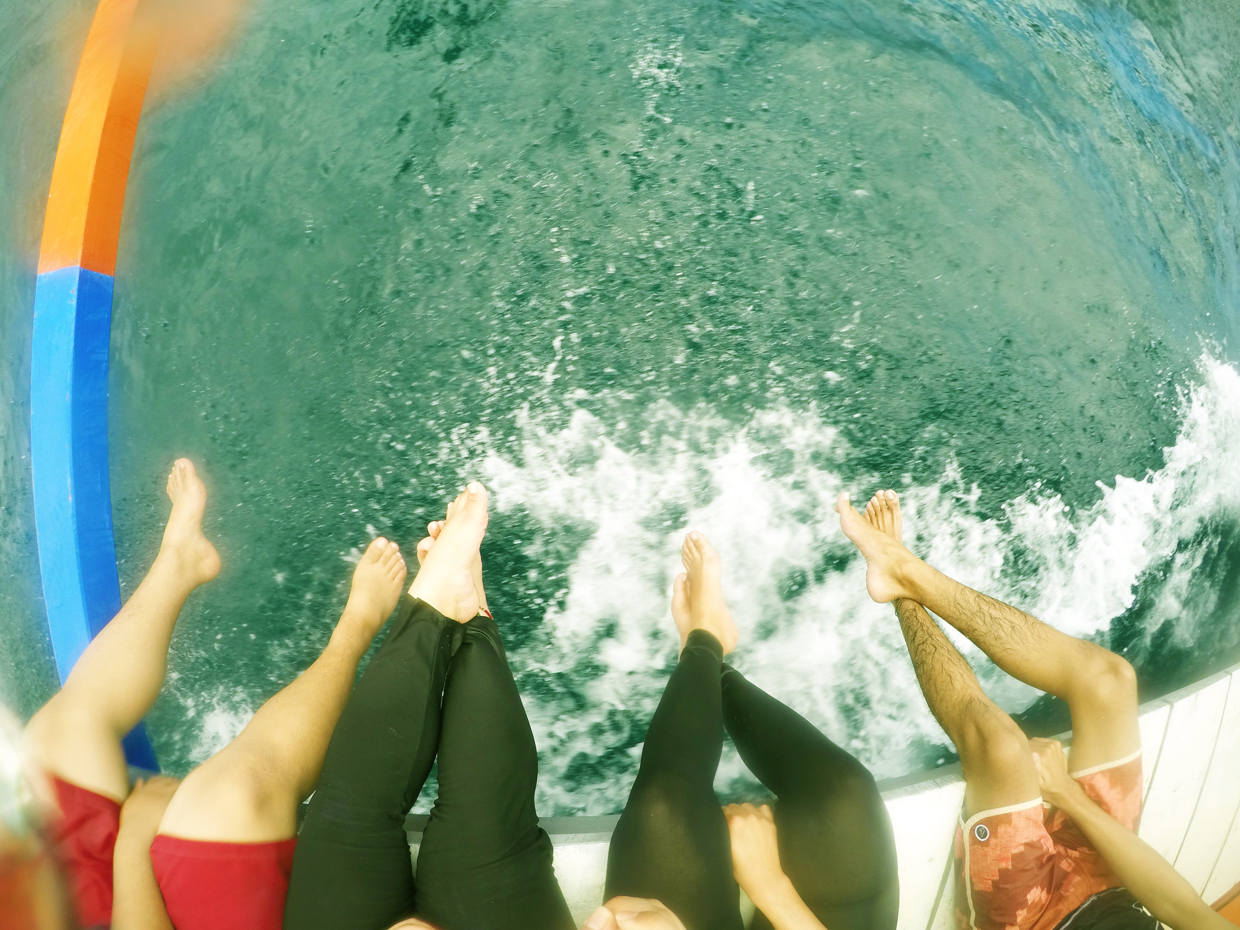 Probably the best part of riding the boat is when you and your friends can dip your feet into the splashing waves. Photo by Bianne Yee