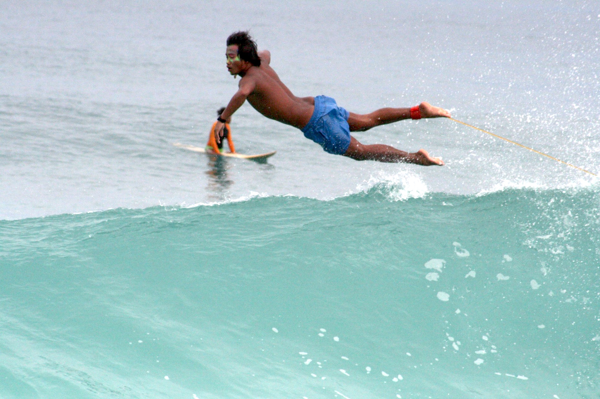 Alex Solitaria flying off a wave that just closed out on him in Dahican’s beach break. For more surf action shots, check Alex’s Instagram (@alexxsolitaria).
