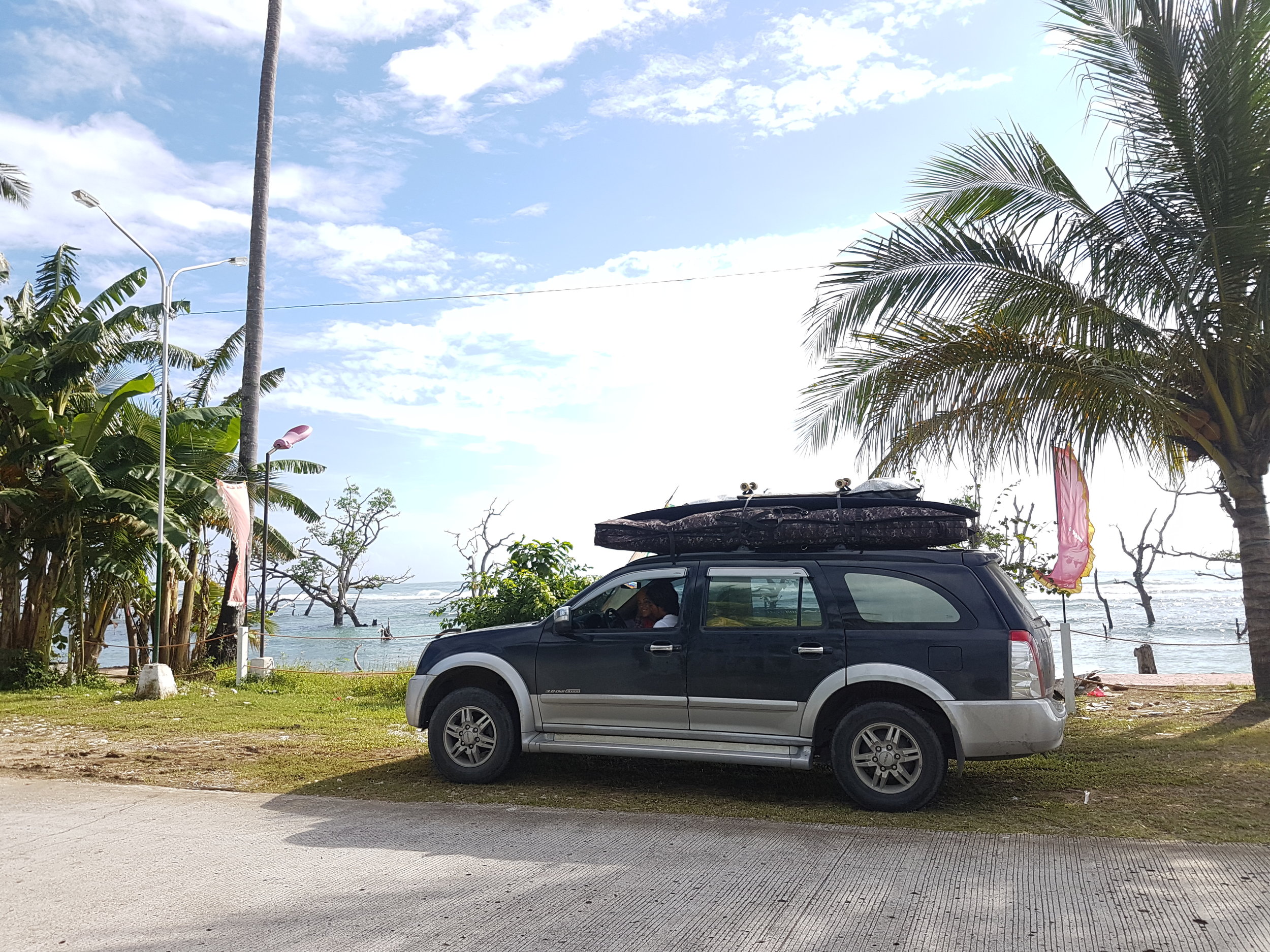 Joven's sturdy metal steed. See all of our boards stacked up? It was amazing it held all of it. 7 surf boards and 2 longboard (wheeled ones).