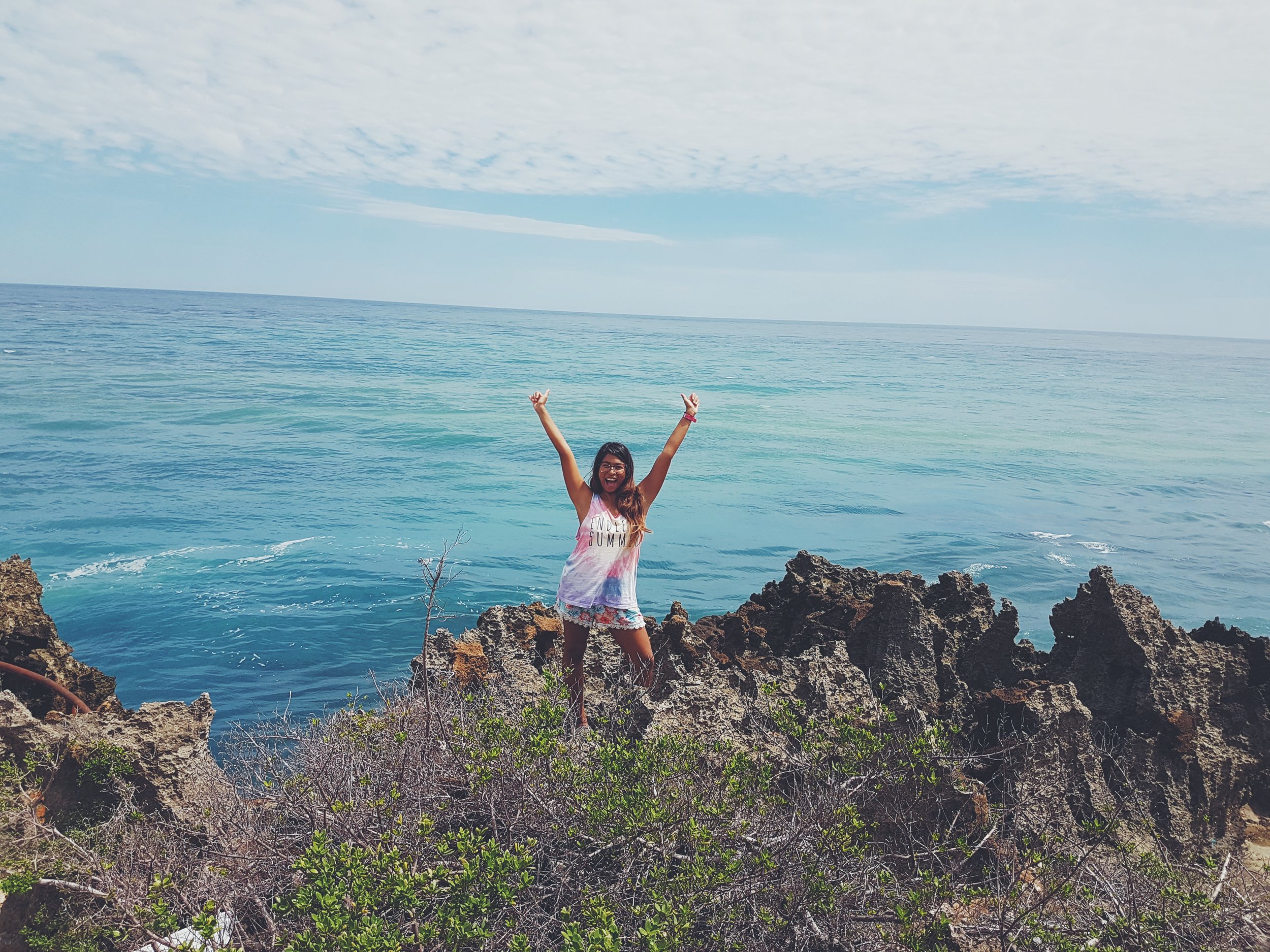 With safety as the utmost precaution, if you’re wearing shoes and can brave the jagged limestone rocks, you can see a little bit more of the ocean at the viewing deck at Pusan Point. Photo by Elli Pangue