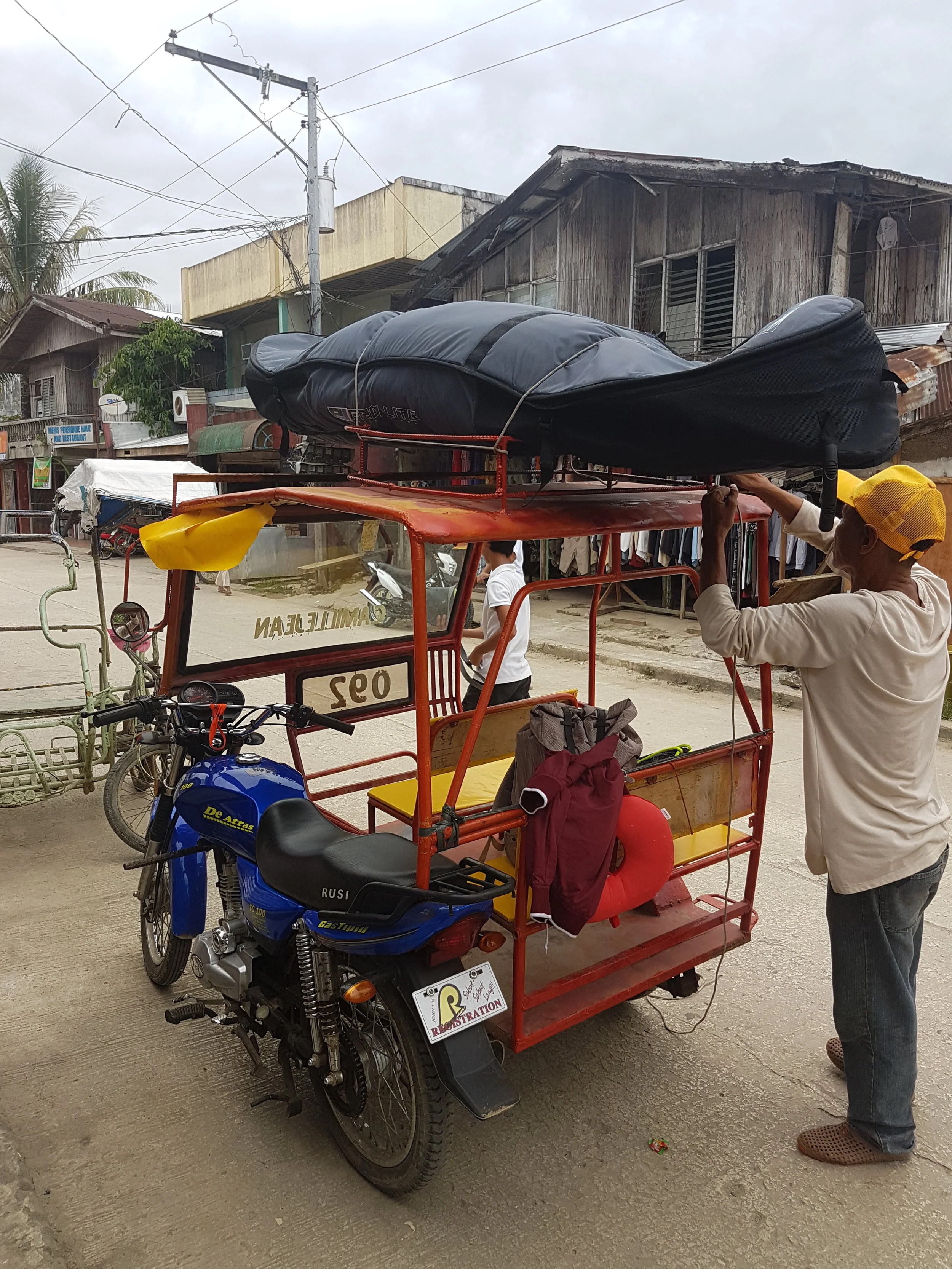 Real struggles of traveling with your surfboard. Taken in Siargao, September 2017.