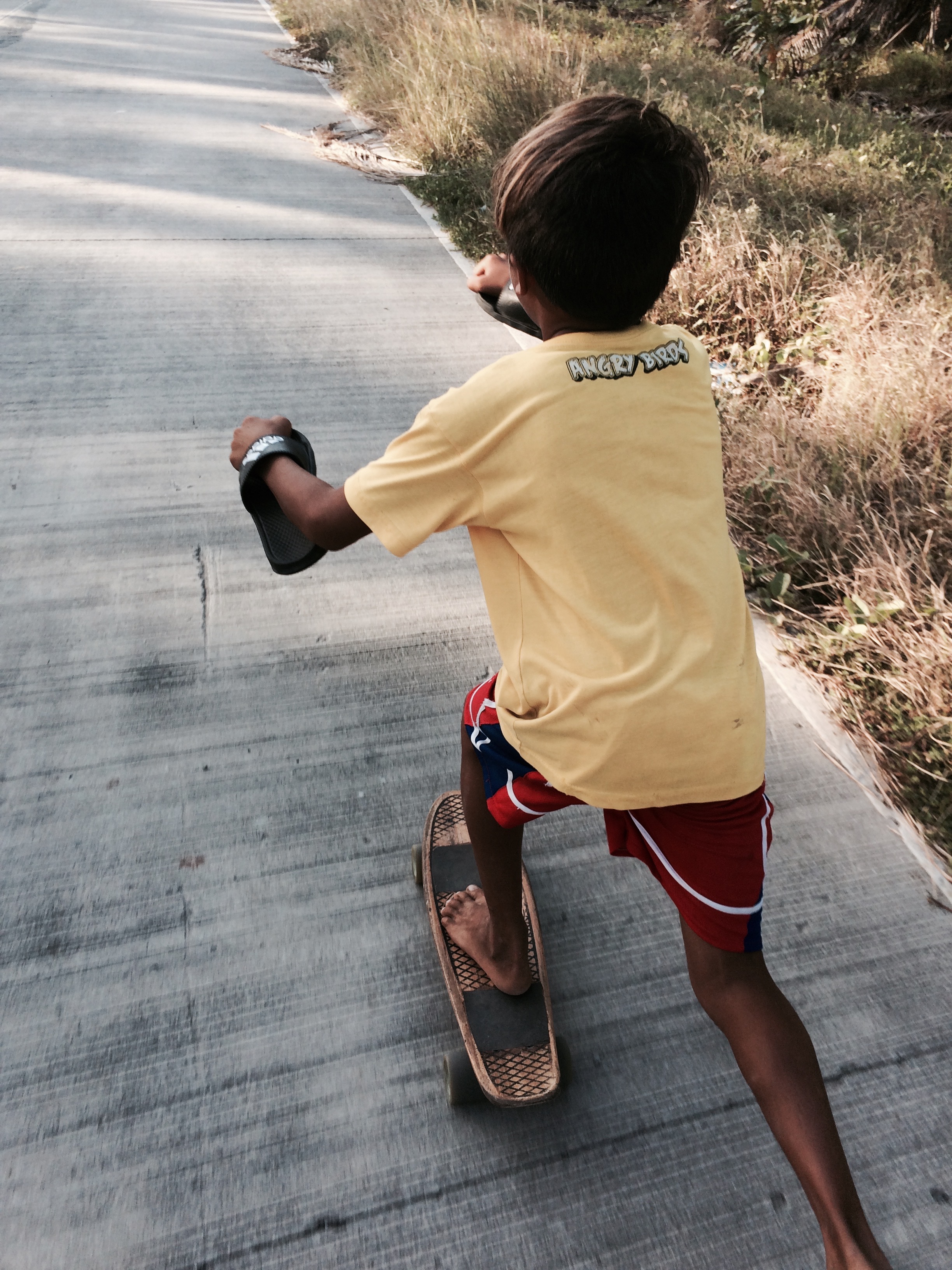 Kids have it so easy. Start them young and they'll learn every trick there is before I could even learn to slide. Photo by Cheen.