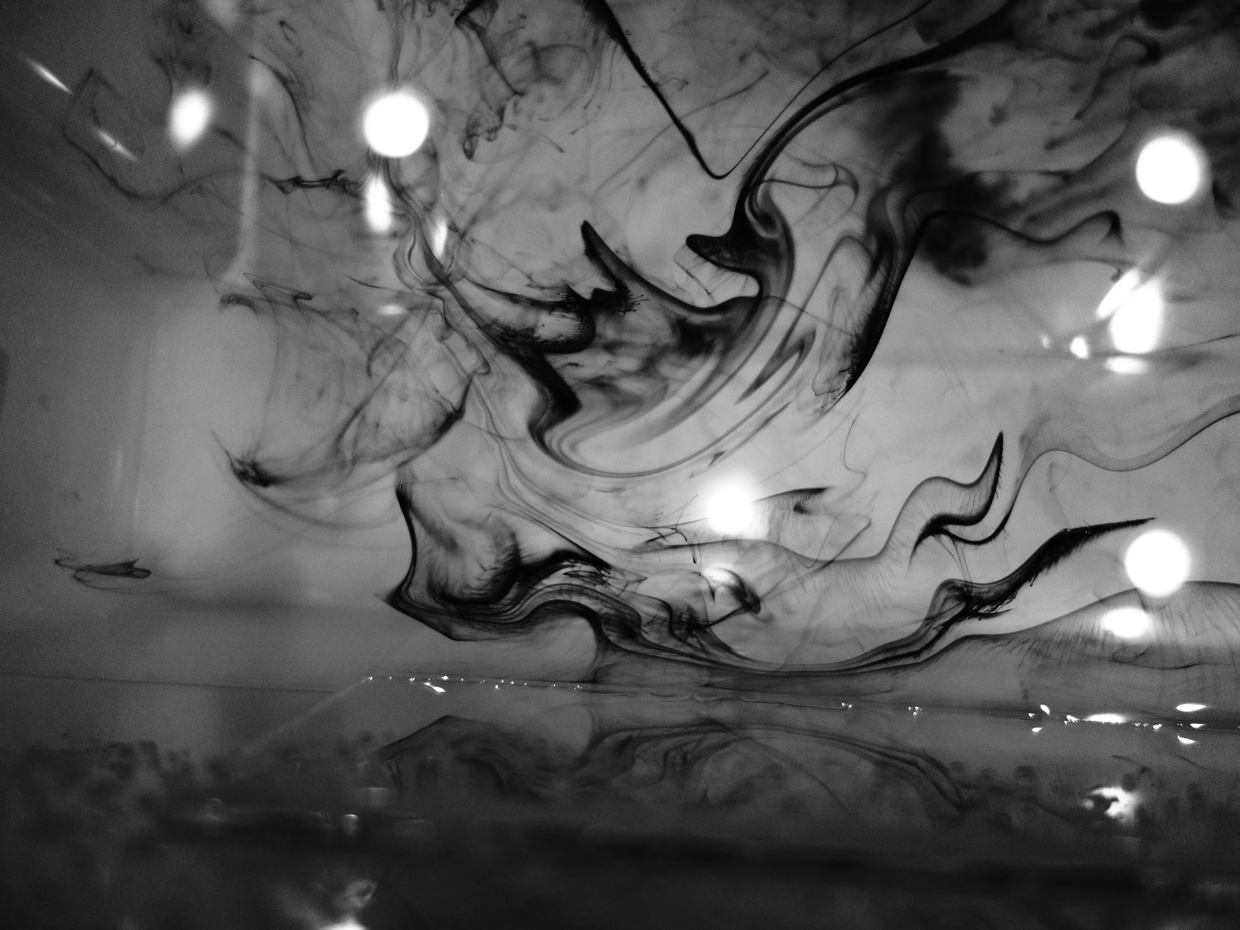 Above the Storm, 2017 Photograph - Ink flow and orbs on water ©kellycorrell