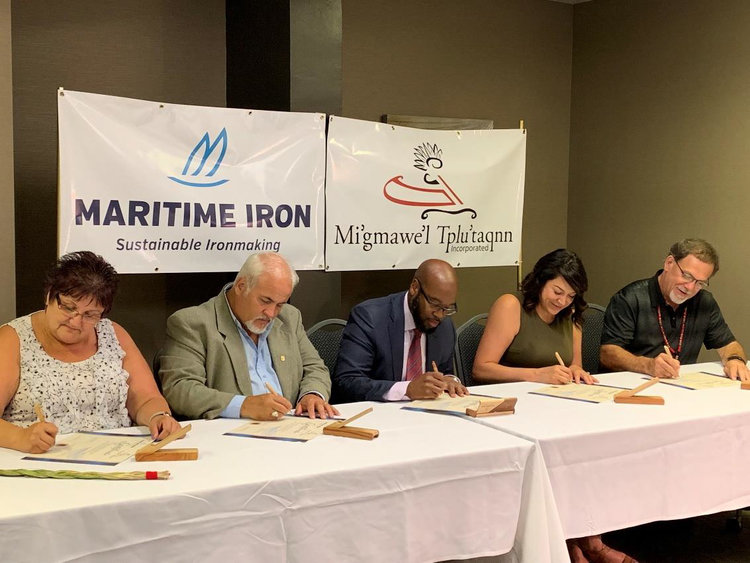 Seated from Left to Right: Chief Rebecca Knockwood, Co-Chair, MTI; Chief David Peter-Paul, Pabineau First Nation; Greg McKenzie, Chairman &amp; CEO, Maritime Iron; Chief Sacha LaBillois, Eel River Bar First Nation; Chief George Ginnish, Co-Chair, MTI.