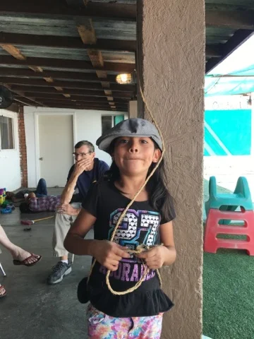 Evelyn with Tata Lee's hat....