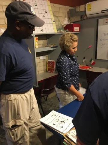 Greg with the director of the orphanage, Maria Luisa - touring the on-room schoolhouse