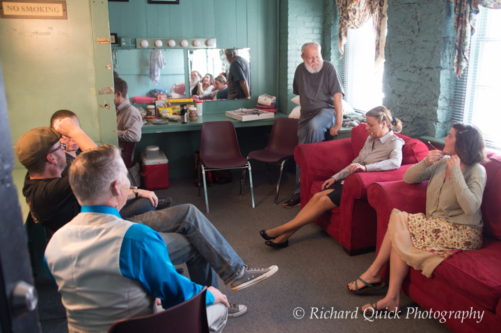 Director Larry Horns provides pep talk to cast in green room.