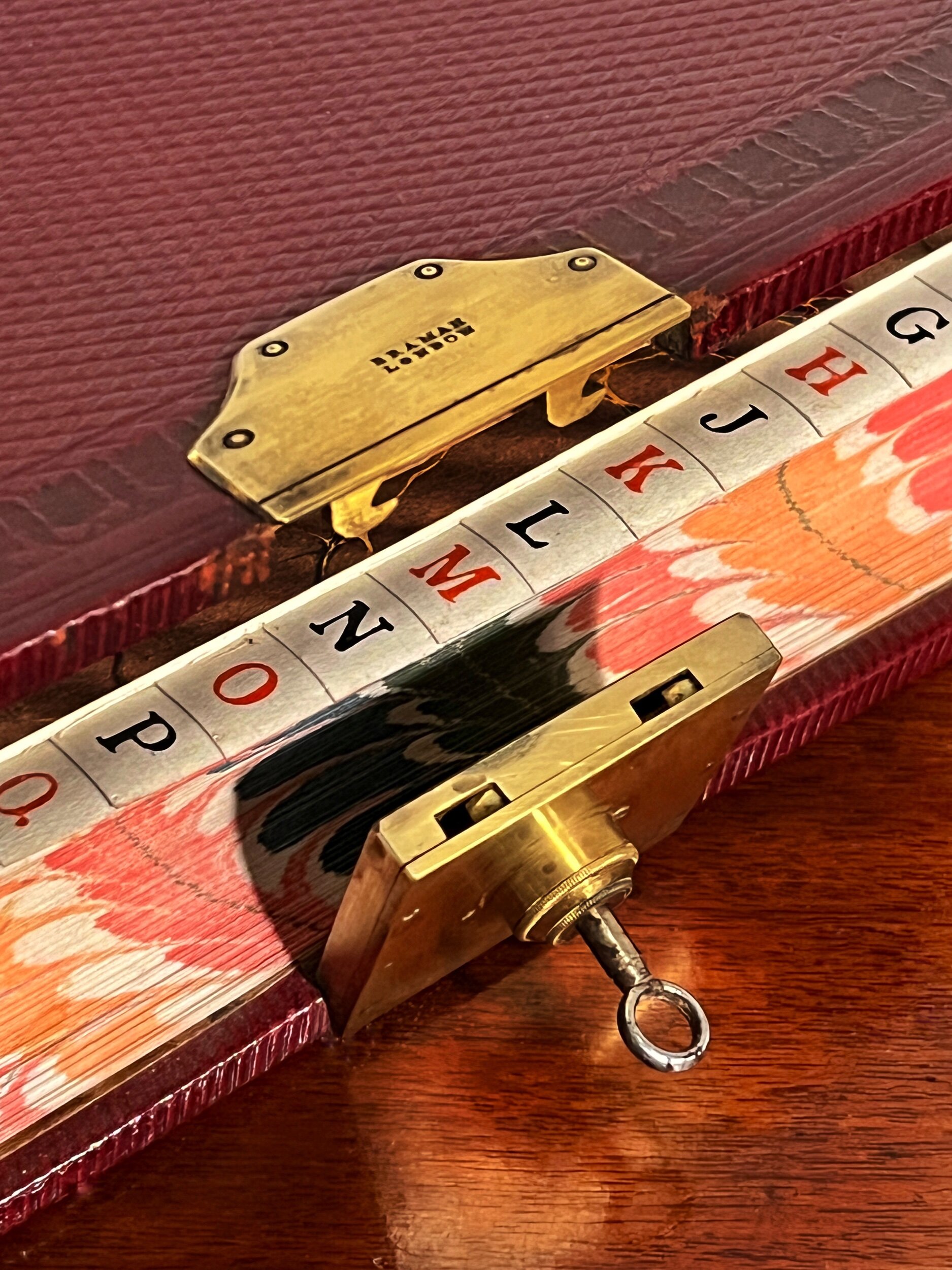 Red Leather Bound Book with Bramah Lock, England. 19th Century.