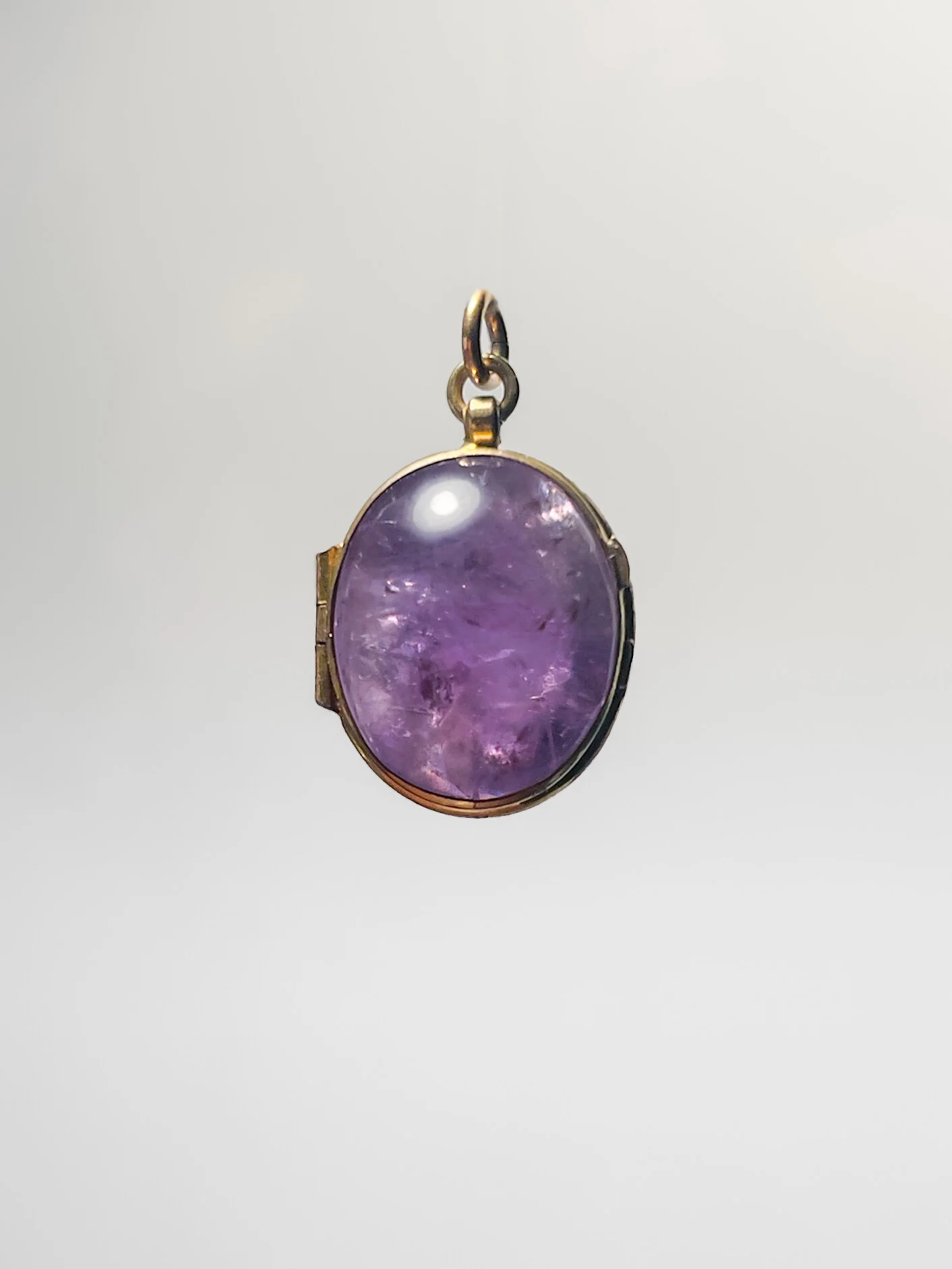 An antique amethyst locket