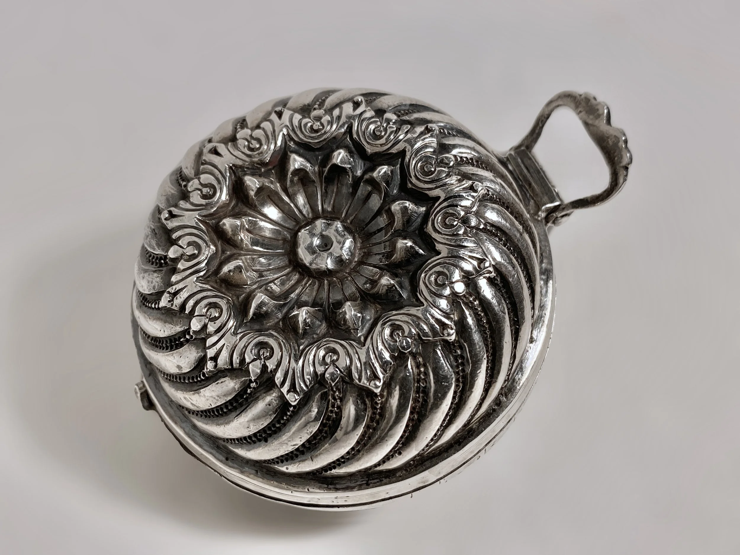 A round silver betel lime box from 19th century India.