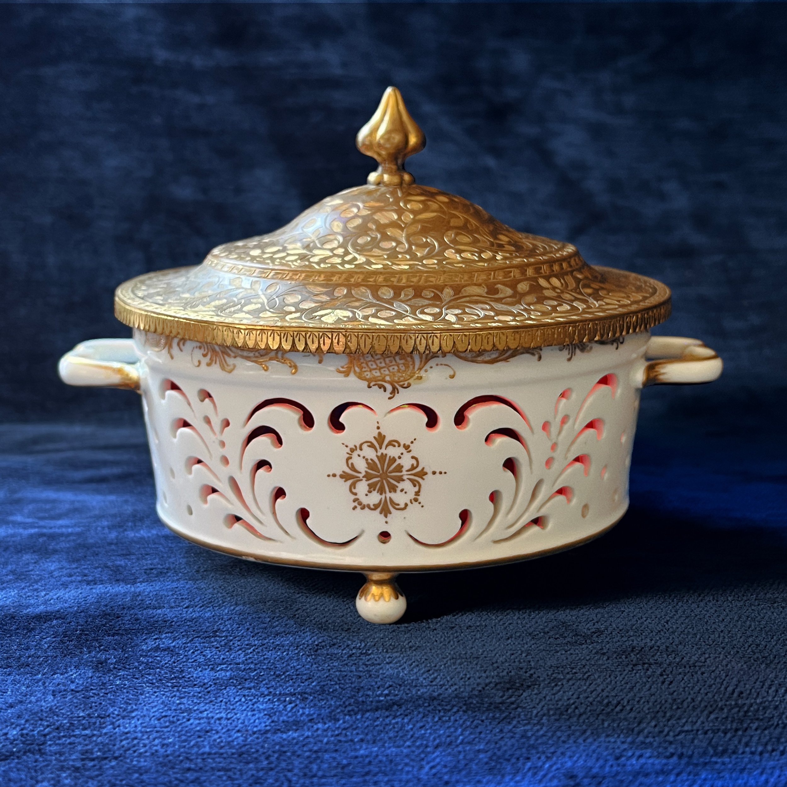 A rare Vincennes porcelain cheese strainer (Egouttoir &agrave; fromage frais) with later (?) ruby glass liner and gilt brass mounts.  Jean-Claude Duplessis designed new forms, such as this strainer which first appeared in 1752, for a dinning service 