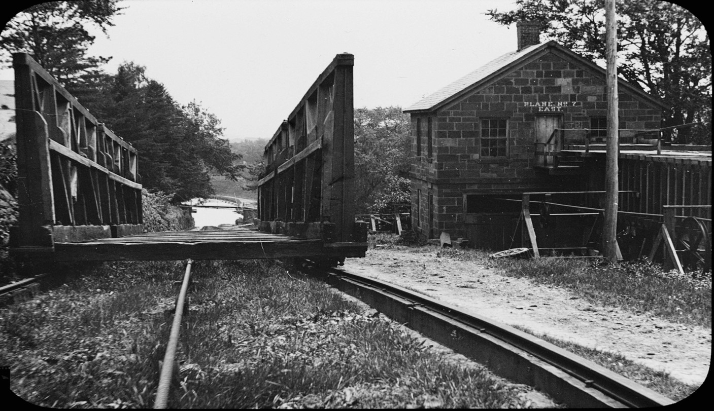 In this photo from the Morris Canal you can see the cable that pulls the boat cradle. 