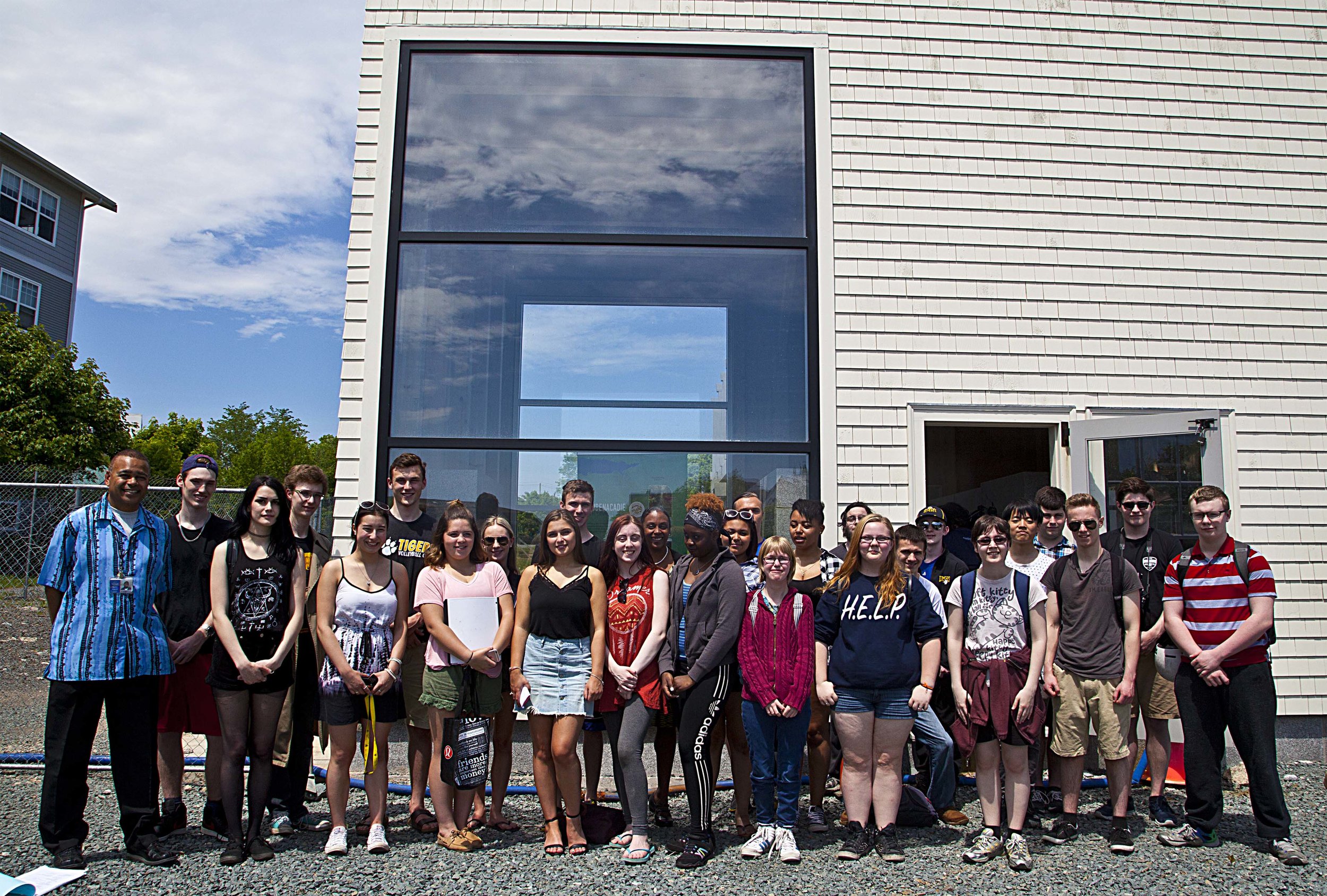 Dartmouth High School Global Geography student s with their teacher (L) Terry Sampson.