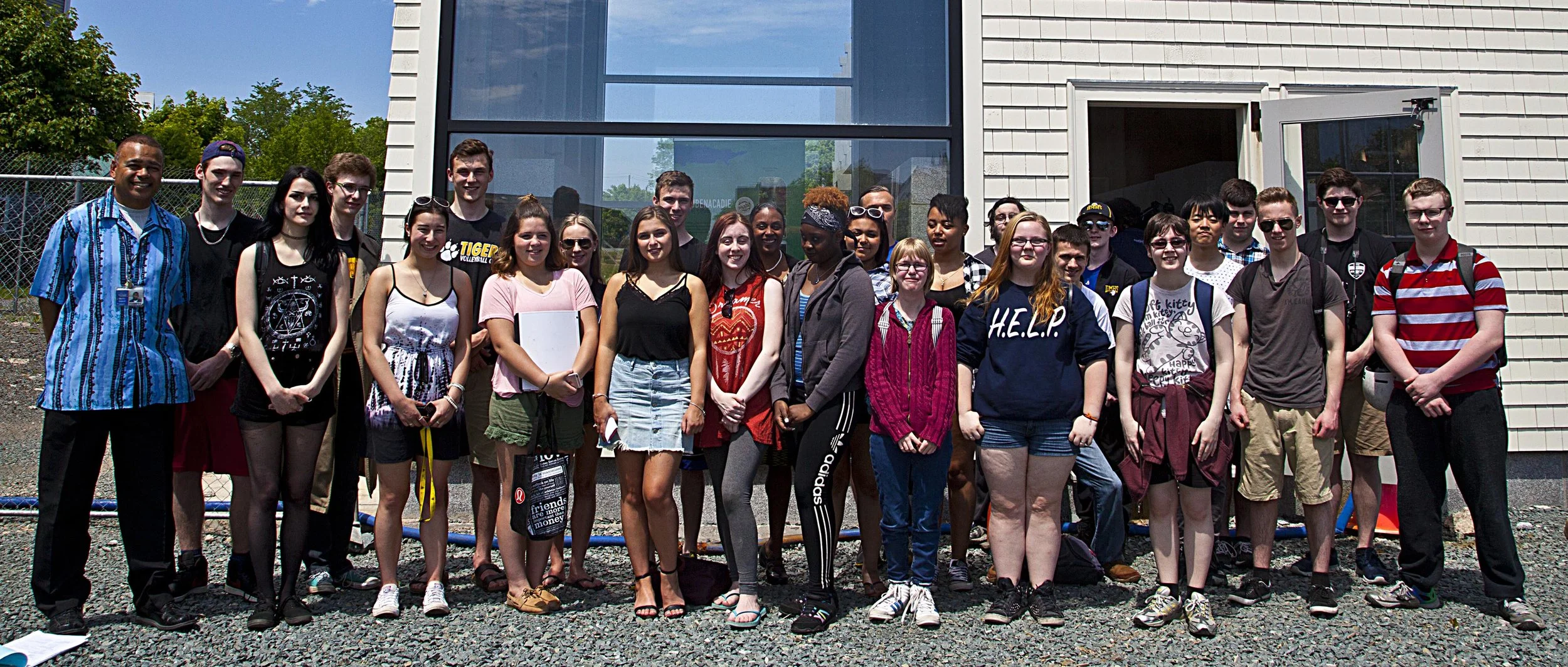 Dartmouth High School Global Geography student s with their teacher (L) Terry Sampson.