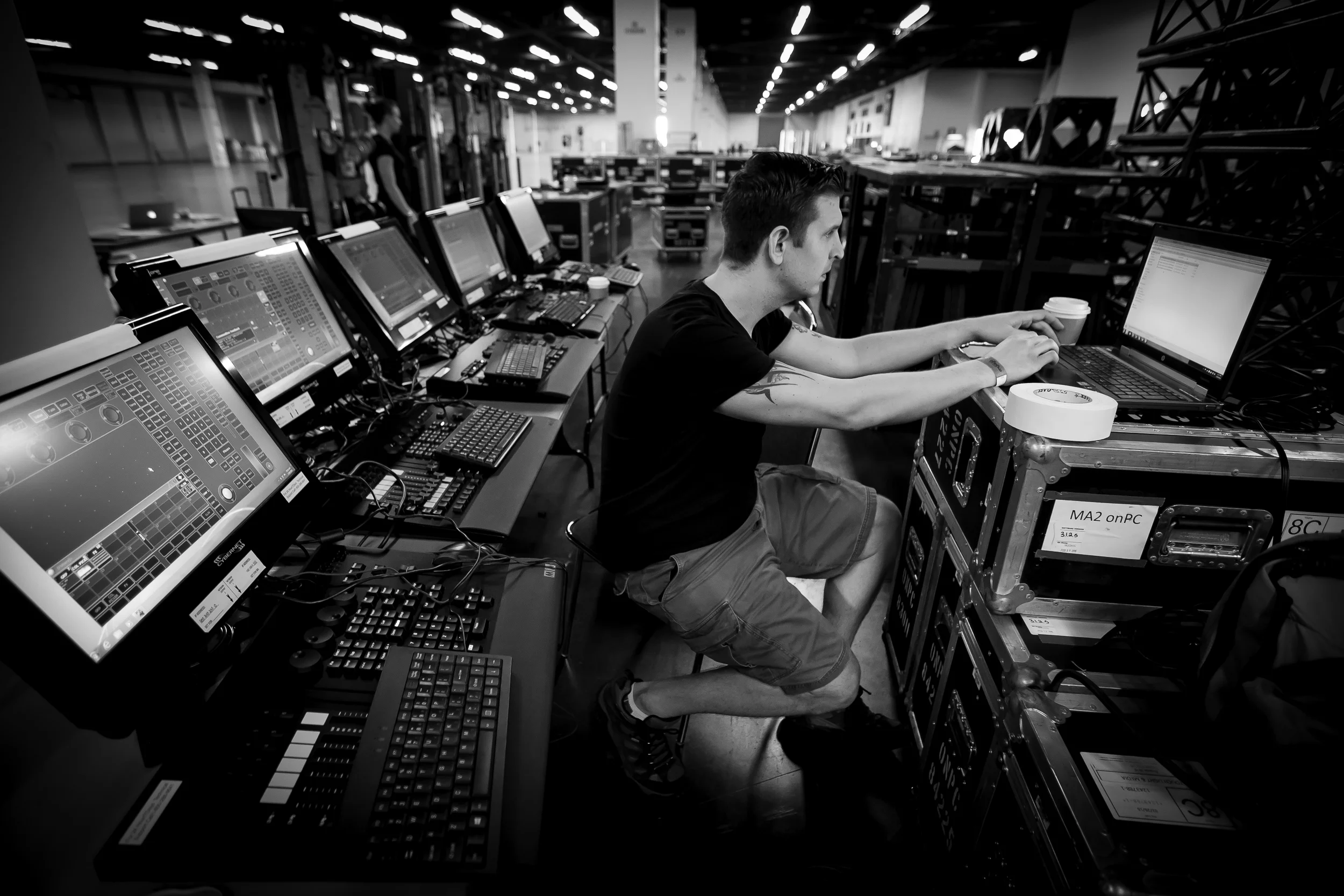 Matt Grinko seen here setting up the dozen or so lighting consoles that were used to control the automated lighting for an event at the Anaheim Convention Center.