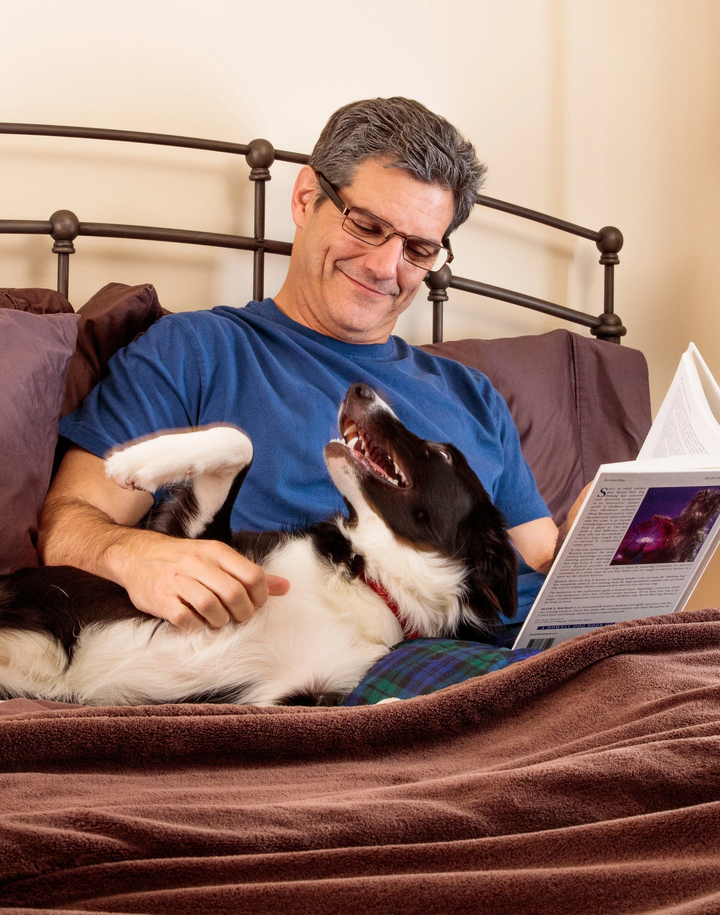 Man with dog in bed
