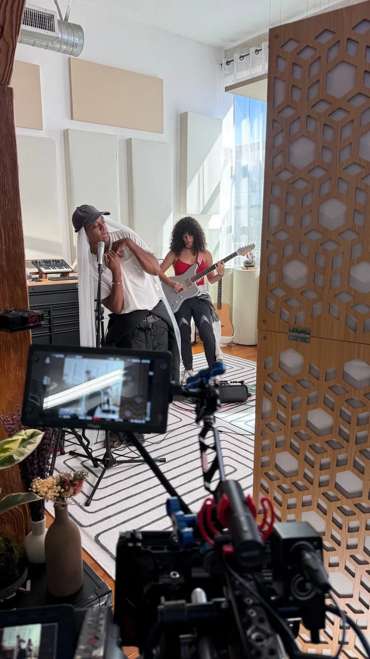 Behind the scenes of Parrka* performing with a guitarist in the studio