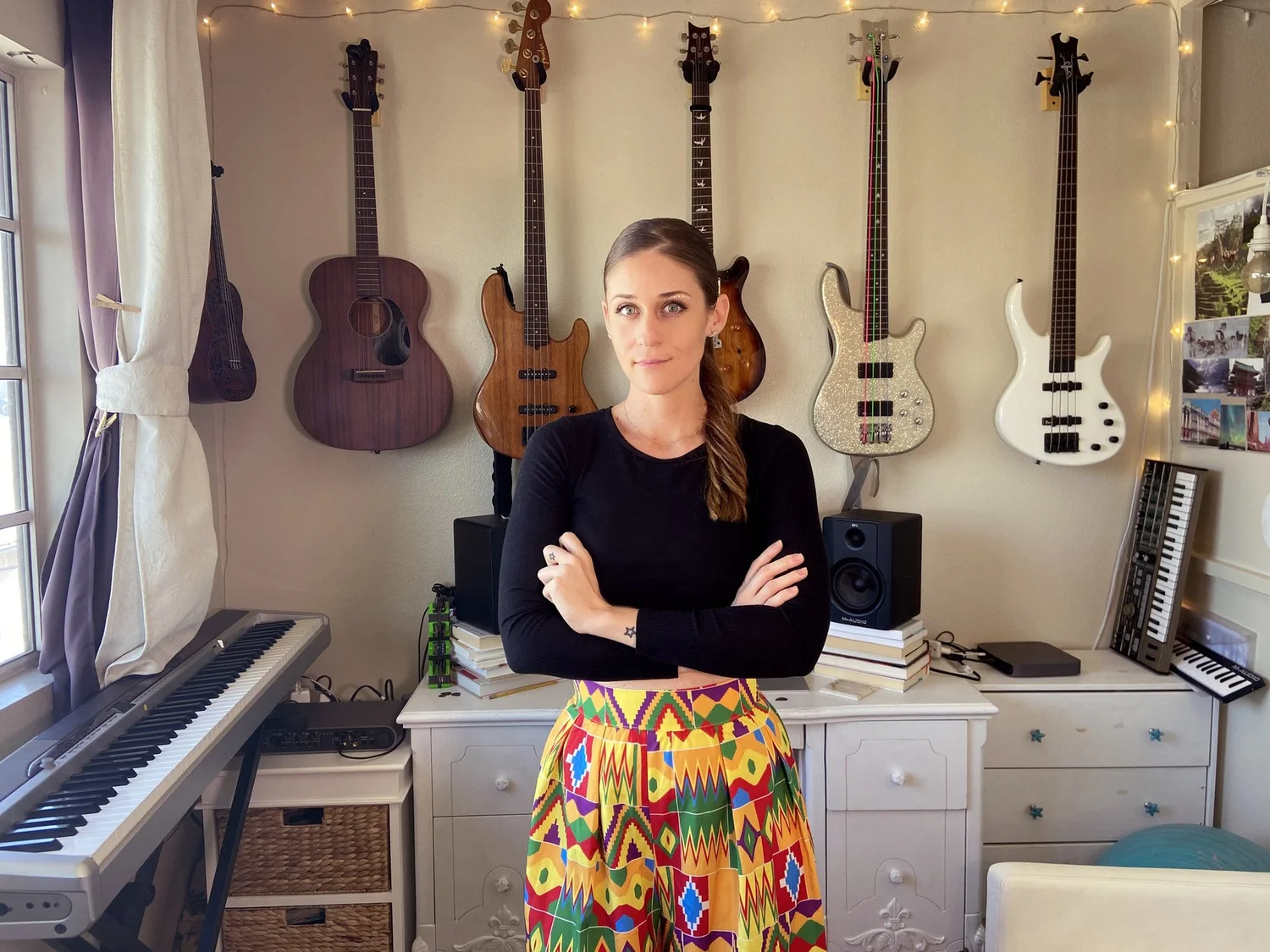 Moana Avvenenti in her home music studio with guitars, basses and keyboards