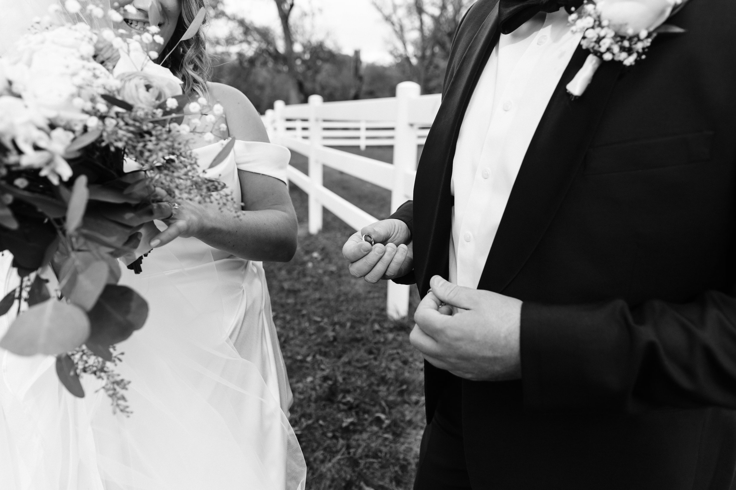 Groom holding rings at St. James Farm Forest Preserve