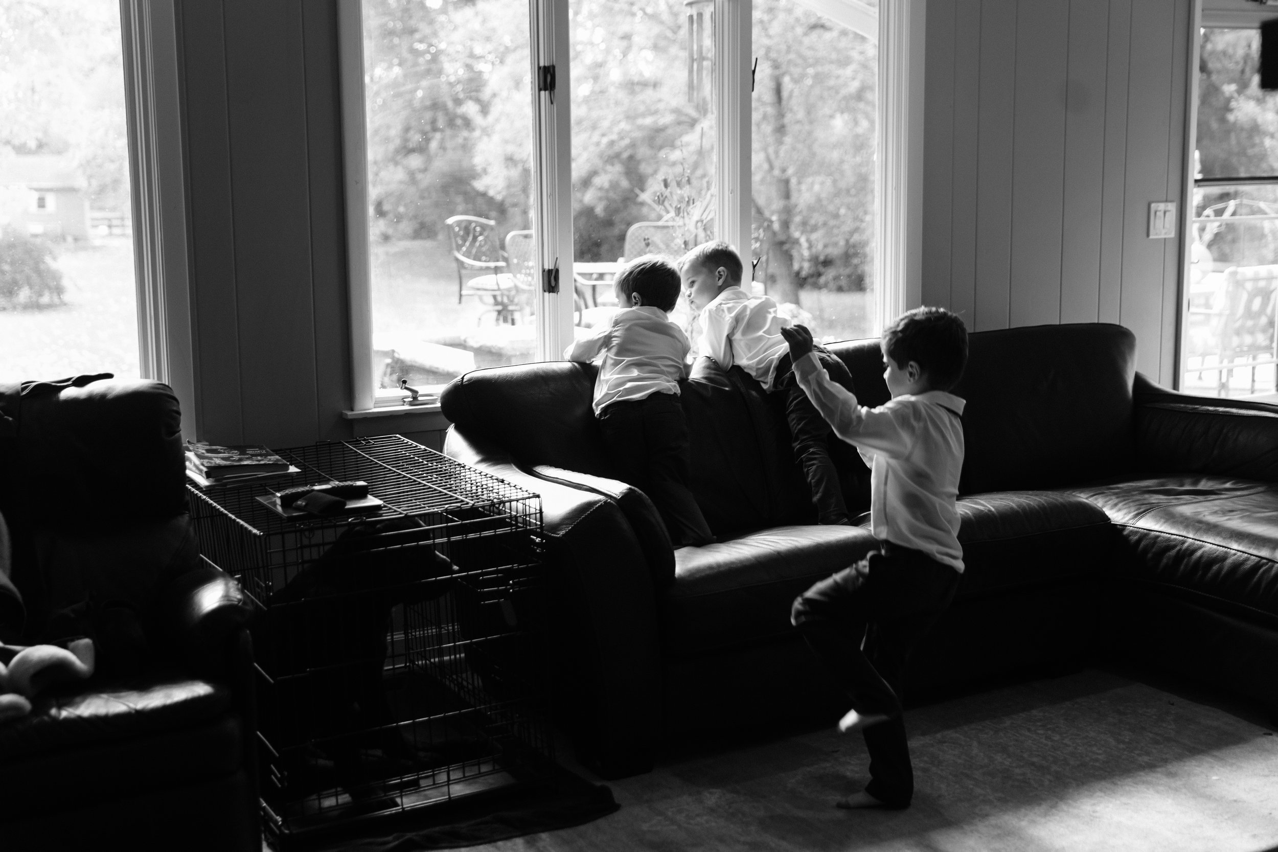 Candid photo of kids playing while getting ready for a wedding