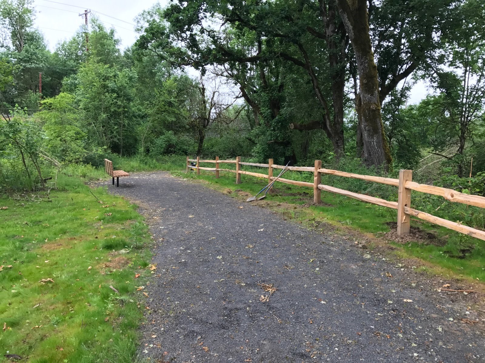  Gentle paths lead visitors through the site, while split-rail fences protect newly planted native plants.&nbsp; 