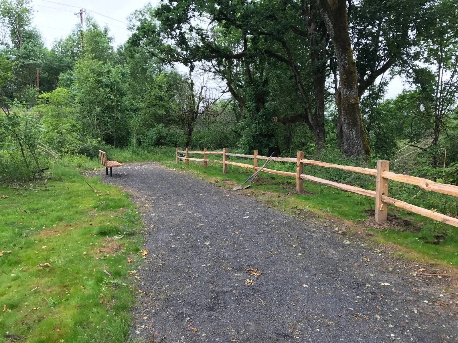 Gentle paths lead visitors through the site, while split-rail fences protect newly planted native plants. 