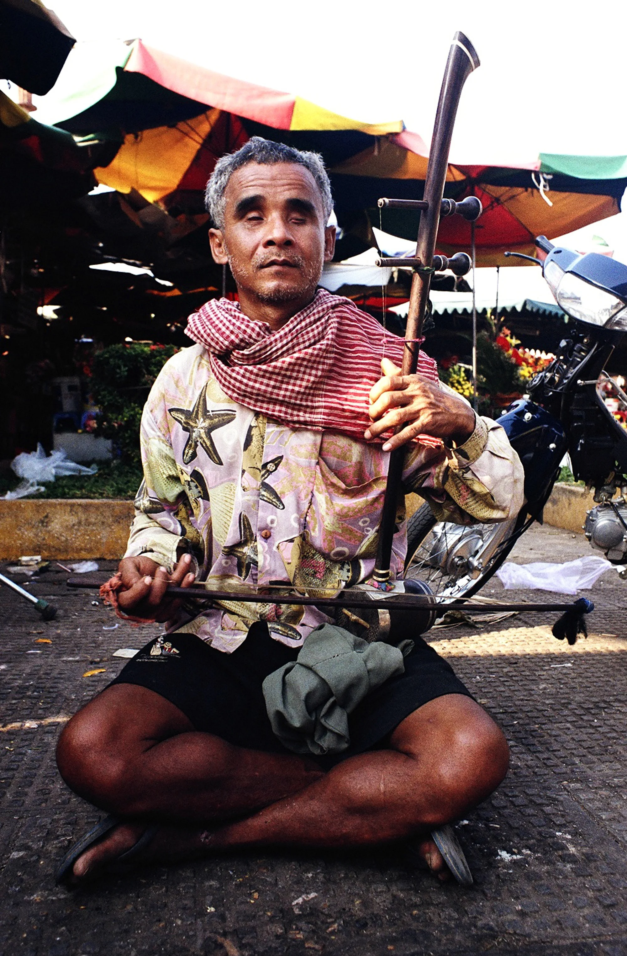 Blind Minstrel, Phnom Penh, Cambodia. 2005.