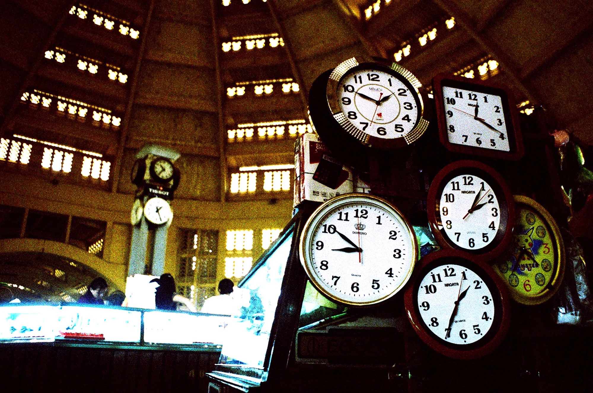 Clocks in Psar Thmei. Phnom Penh, Cambodia. 2004.