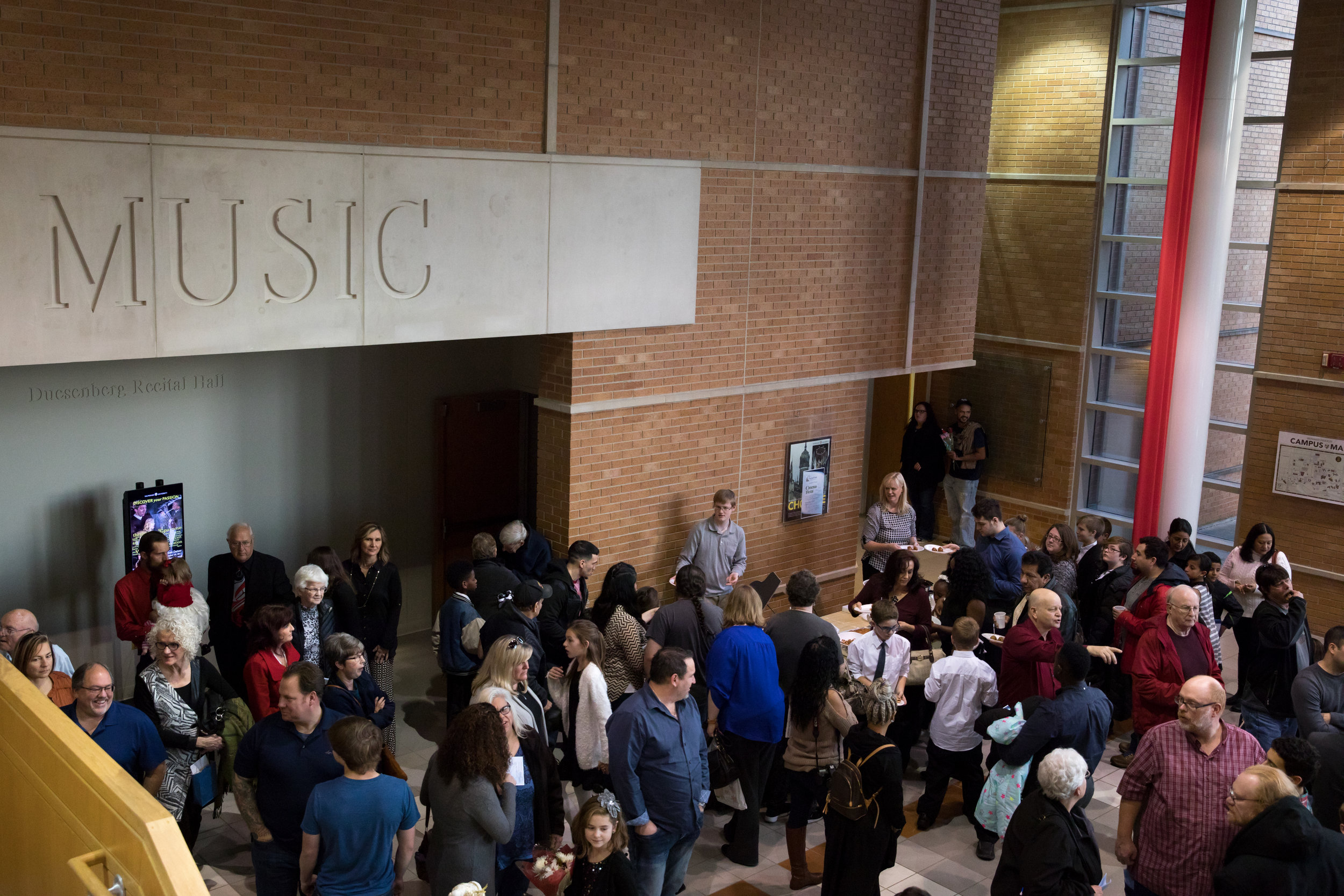 people gathered with music sign in backgroun-1.JPG