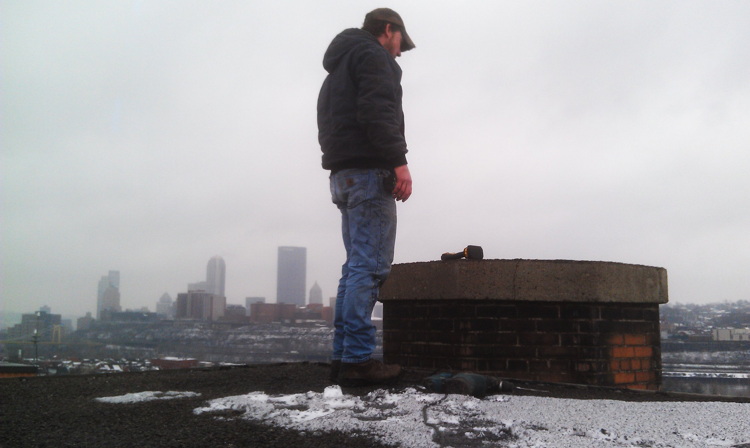 Zach standing above the skyline.jpg