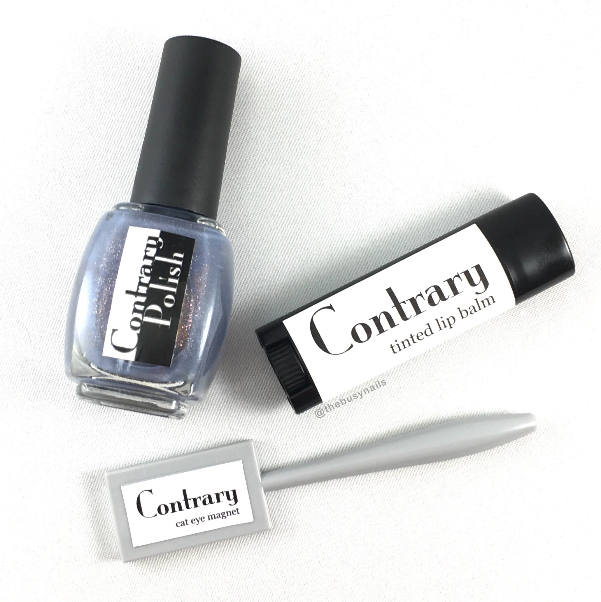 "Cocoon Galaxy" magnetic nail polish, "Solar Flare" tinted lip balm and cat eye magnet