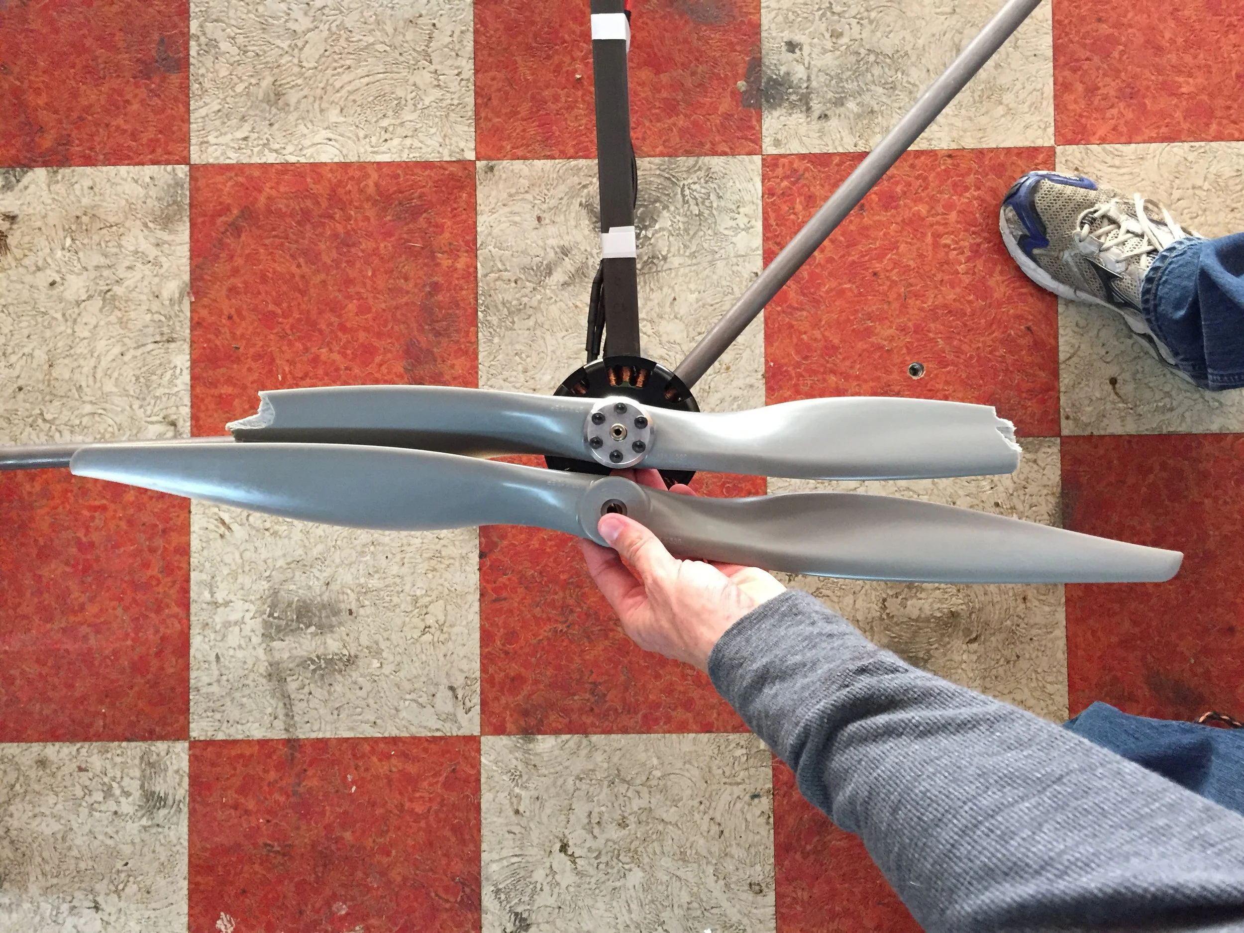  Flight test #2 caused significant damage to several propellers.&nbsp; You can see just how much propeller is missing in this photo. 