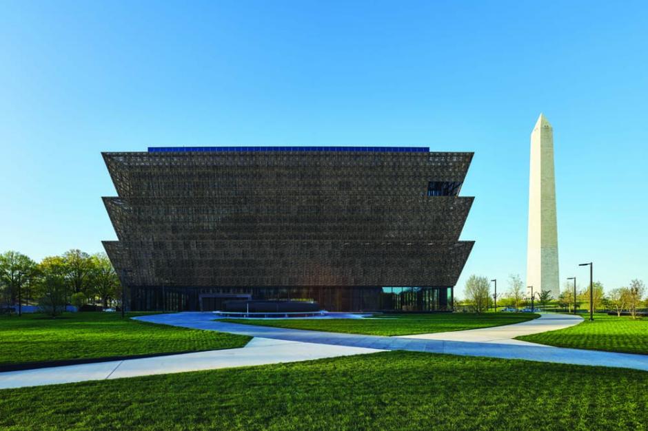 Vista of the Museum from Constitution Avenue, looking across the north lawn to the Washington Monument. Photo credit: Alan Karchmer/NMAAHC