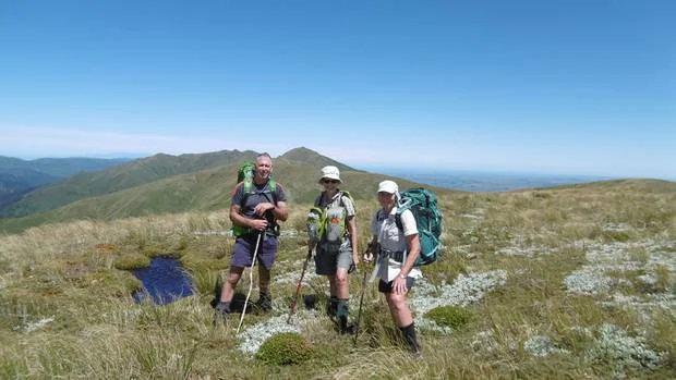 Calm before the storm on the Ruahine tops, from left, Mark Sutherland, Cherry Channon and Val Wackrow.