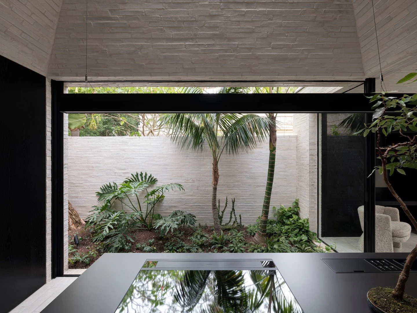 In designing the &quot;Vessel&quot; project, @madeleineblanchfieldarchitects skilfully shaped Krause Emperor Bricks to form funnels of light, drawing daylight deep into the home and creating a bright, dynamic interior. 

This highlights the unique ab