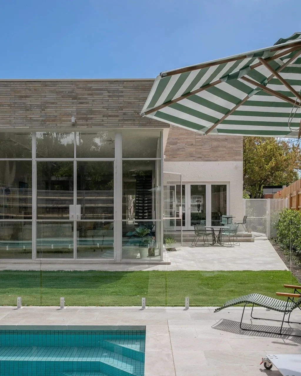 Summer is just around the corner, and this is the kind of sun-drenched, poolside paradise we're all dreaming of.

The serene backdrop is created with Krause Emperor Bricks in Ghost. Their soft, luminous white tones enhance the natural light, making t