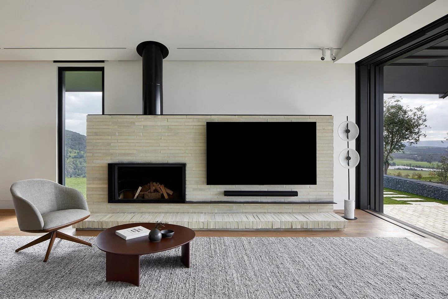 At Gruyere Farmhouse by @rachcoffvella, Krause Emperor Bricks create a stunning, tactile centrepiece for the living space. Used for the hearth and fireplace, the bricks draw the natural textures and colours of the Yarra Valley surroundings inside, pr