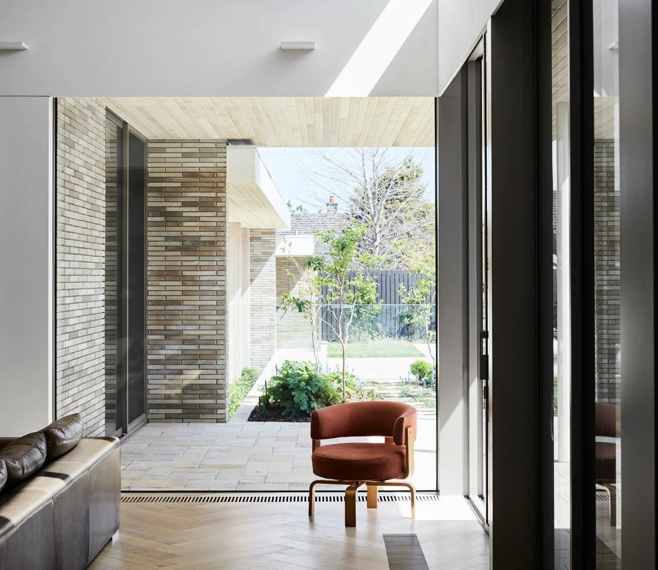 We love how the exterior brickwork of this Caulfield North home extends right through the glass and into the living space. The natural texture and subtle tonal variations of Krause Emperor Bricks in Ghost bring an earthy warmth to the interior, perfe