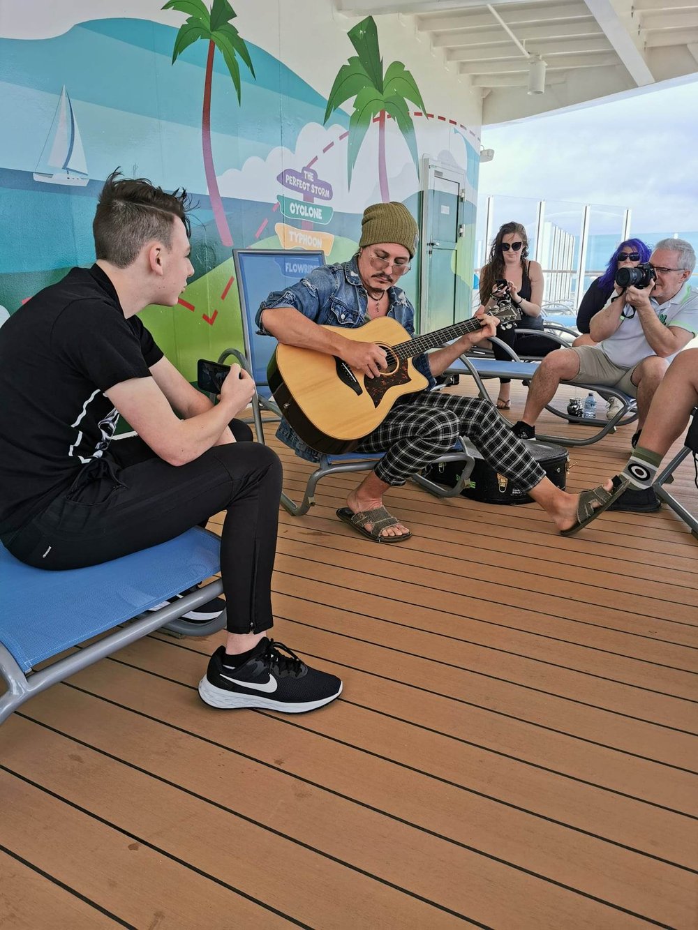  With an impromptu acoustic set on the deck 