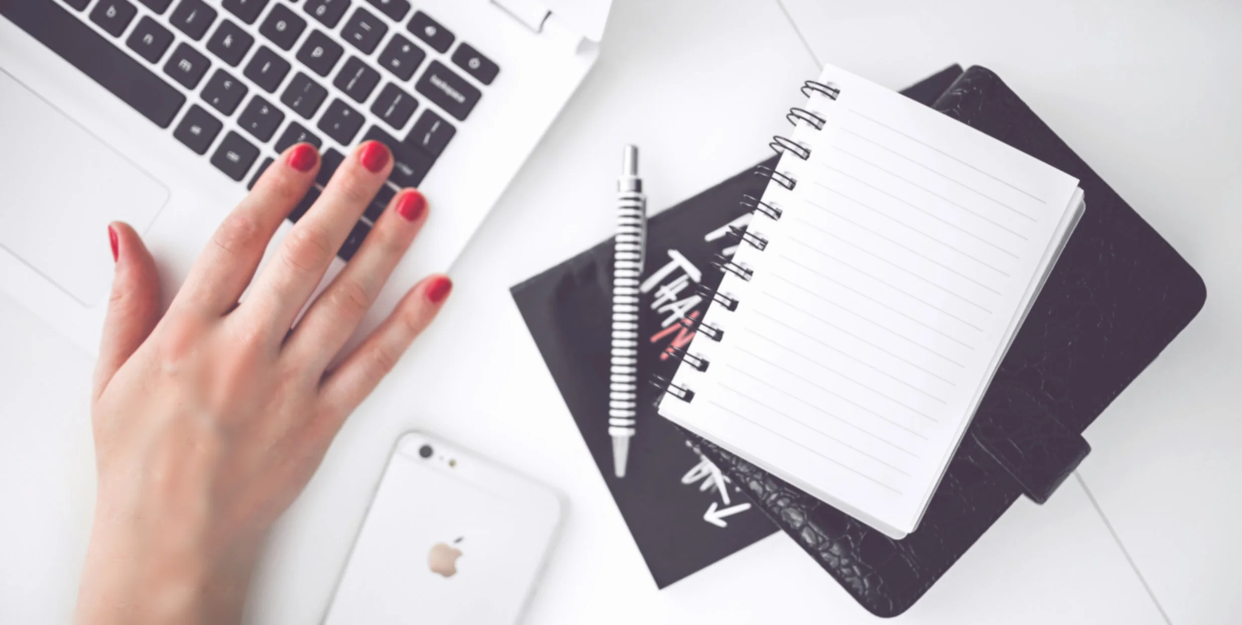 woman-hand-smartphone-desk.jpg
